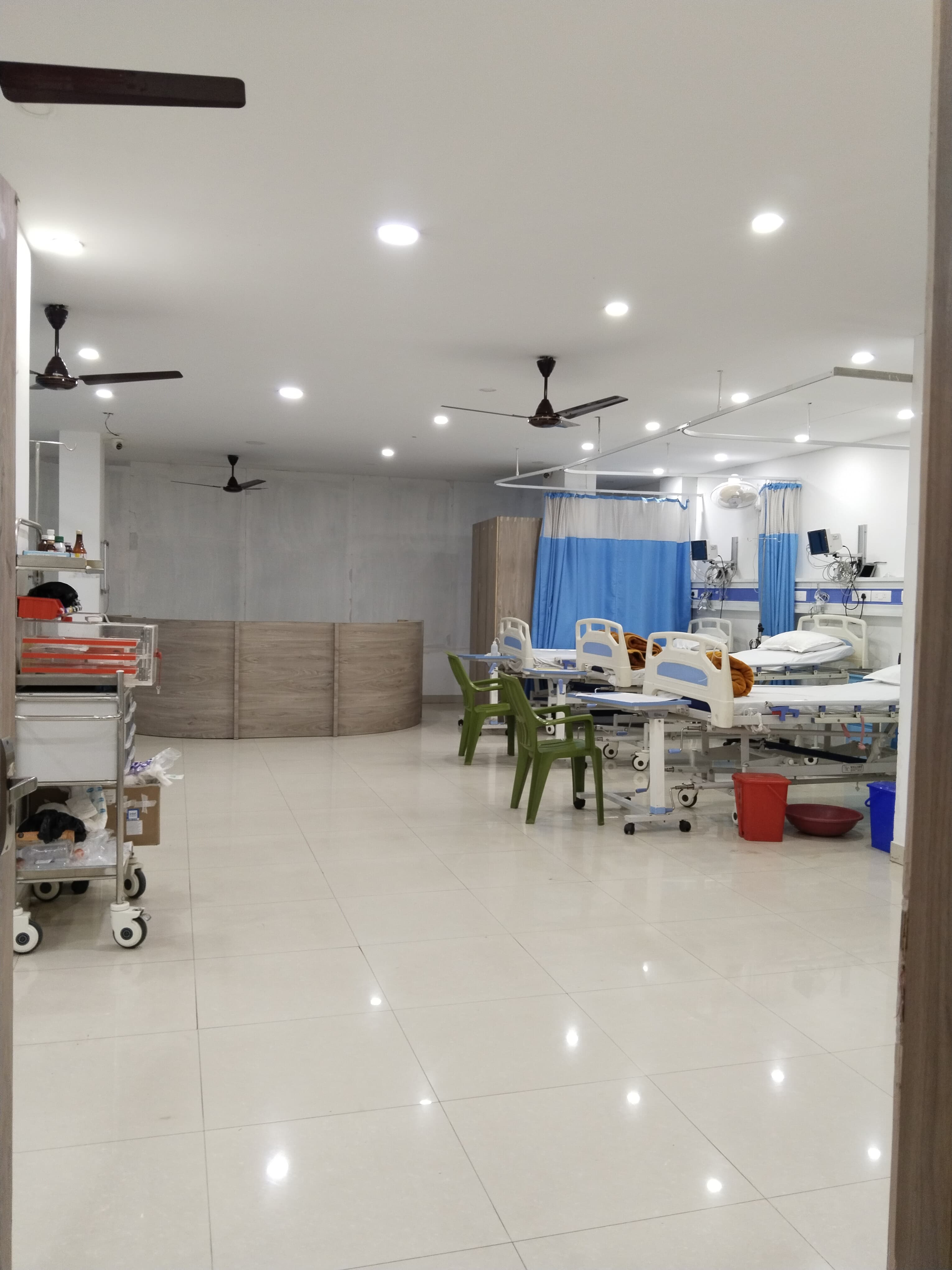 Patient ward with beds and monitors at Navya Hospital